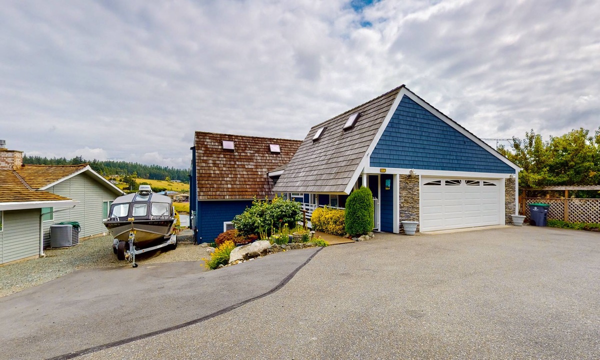 Oak Harbor House | Waterfront home with private dock, kayaks, sauna, firepit, fireplace, tennis