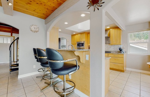 Oak Harbor House | Waterfront home with private dock, kayaks, sauna, firepit, fireplace, tennis