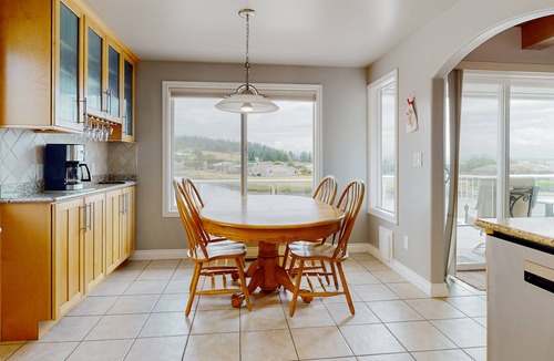 Oak Harbor House | Waterfront home with private dock, kayaks, sauna, firepit, fireplace, tennis