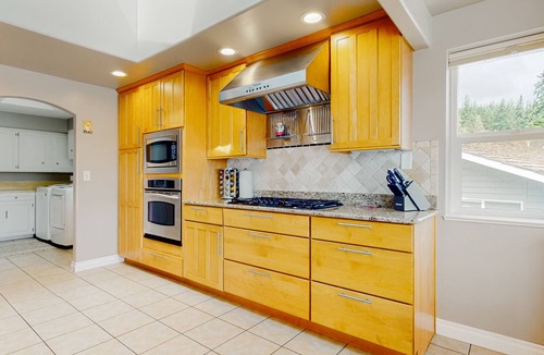 Oak Harbor House | Waterfront home with private dock, kayaks, sauna, firepit, fireplace, tennis