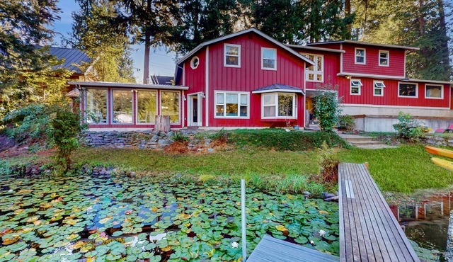 Family-friendly lakefront escape with outdoor patio dining and private dock